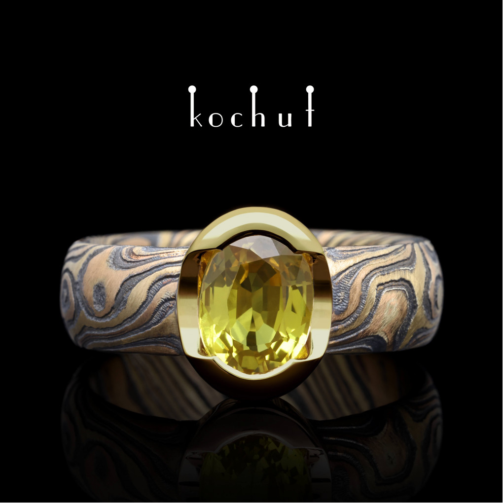 Ring mocume «Sophora». Red and yellow gold, etched silver, oxidized, yellow sapphire